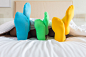 Close up foots of family with color sock on the bed