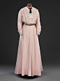 Day Dress, Britain, 1908: This pink linen dress bears no makers label, but is likely to be made by a high end dressmaker of the sort employed for less important and less costly gowns. The centre front of the skirt is cut on the cross, giving a graceful ha