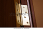 Metal hinge on a wooden entrance door, interior door hinge.