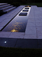 Using water features with lighting in minimalist design schemes