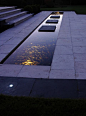 Using water features with lighting in minimalist design schemes: 