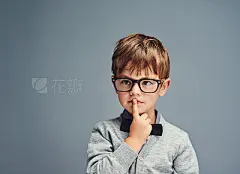 Question everythingStudio shot of a smartly dressed little boy looking thoughtful against a gray background
