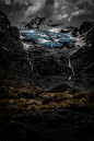 gray and blue rock mountain under gray sky