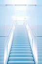 white stair case in the office with white lights, in the style of light sky-blue, surrealistic futuristic, unsettling emptiness, dusseldorf school of photography, minimalistic symmetry, translucent color, realistic hyper-detail