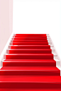 White striped carpet on a red stairs, in the style of minimalist backgrounds, award-winning, high-key lighting, 32k uhd, minimalist stage designs, soft-edged, white background