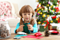 little-girl-making-felt-christmas-fir-tree-table