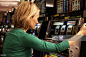 Woman pulling lever on slot machine at casino. : Stock Photo
