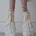 This contains an image of: [$47.57]Beige Bowknots Tiered Leg Warmers Lace-up Detail