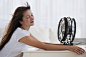 Fan blowing woman's face