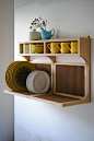 Super efficient--and stunning--dish storage from British bespoke furniture company. You'll find them here: http://www.setyard.co.uk/
