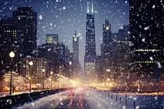 大雪纷飞雪景下的城市摄影图