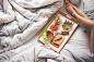 Young Woman Enjoying Morning Breakfast in Bed Free Image Download