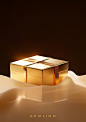 golden gift box on a table with black background, in the style of isaac julien, calm and serene beauty, explosive pigmentation, maya lin, rené laloux, sunrays shine upon it, crisp and clean look