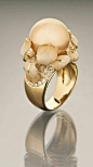 An Exquisite 18K Yellow Gold Floral Ring with a Golden South Sea Pearl Cradled in a Setting of Iris Petals. 