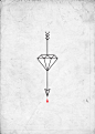 Arrow/diamond tattoo.: