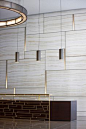 Hospitality Reception Desk, brass trim, marble walls