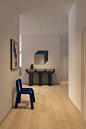两把造型别致的座椅营造出一种轻盈韵律感，精致的木石柜体又渲染出空间摩登的艺术格调。