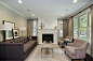 Mid-sized transitional formal dark wood floor living room photo in Chicago with gray walls, a standard fireplace and no tv