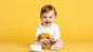 Close up on child using smart device on yellow background