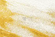 金色闪光的沙子纹理上白色，抽象的背景。