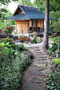 Great walk way!  Love the stepping stones and how both side are covered in green ivy.  Very inviting!