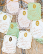 Monogrammed escort cards in green and white