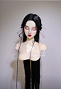 This may contain: a mannequin with long black hair and red lips