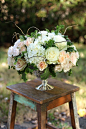 Low centerpiece with curly willow, white hydrangea, Mondial roses, Quicksand roses, Sahara roses, Chablis spray roses, White Majolica spray ...: 