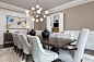 Example of a large transitional dark wood floor and brown floor enclosed dining room design in Atlanta with brown walls and no fireplace