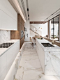 continuing with the light+natural theme. light-coloured wood carpentry. white marble flooring and kitchen.