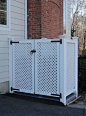 This trash enclosure, by West Hartford Fence, hides large trash and recycling bins behind sedate lattice doors. by West Hartford Fence Co., LLC:
