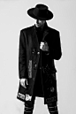 man-wearing-black-hat-and-black-coat-157675