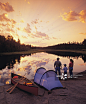 Family camping on riverbank, Whiteshell River, Whiteshell Provincial Park, Manitoba, Canada