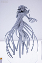 其中可能包括：a white plastic figurine sitting on top of a table