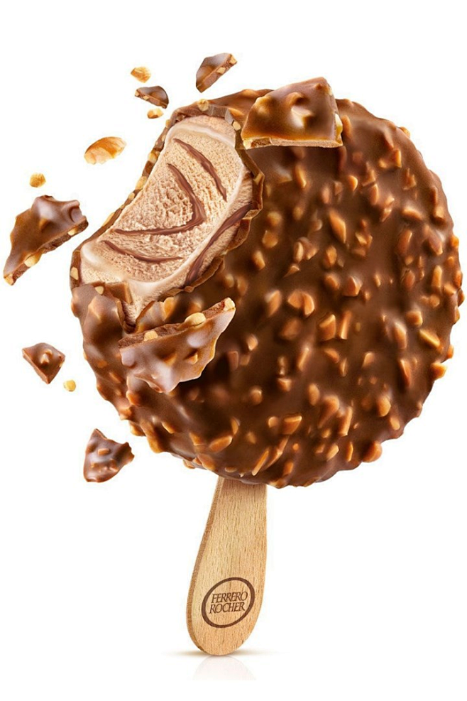 an ice cream scoop with chocolate sprinkles and nuts on it, in front of ...