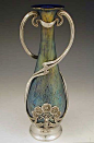 Graceful Loetz & Juventa irridescent glass vase with polished pewter, Austria  Date c.1905