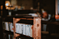 A bookcase with shelves full of old books
