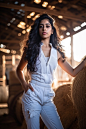 Janhvi Kapoor, wearing a white tanktop, standing in a barn, dynamic pose, fashion photography, portrait, cinematic, accent lighting, global illumination, professional color grading, soft shadows, no contrast, clean sharp focus
