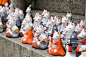 Kitsune or messenger foxes that are a symbol of wealth in Fushimi Inari Shrine, Kyoto, Japan