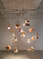 Yuko Nishikawa forms "floating" amorphous lights from shells of clay and paper