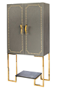 Materials : Wood, leather, metal Measurements : 63"h x 32"w x 16.5" d, 116 pounds 2 doors cabinet is covered with leather that has a linen fabric look. This cabinet has space for wine glasses, 2 drawe