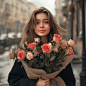 smiling russian woman 25 years old with a bouquet of roses in city