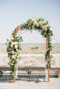 A classic floral ceremony arch | Brides.com: 