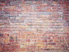 砖墙的背景。棕色和红砖，砖石质地的建筑外观