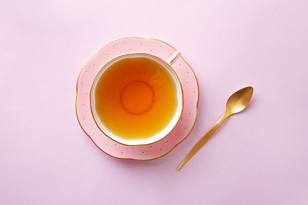 Tea cup on pastel pi...