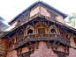 This may contain: an old building with ornate balcony and balconies