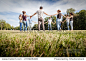 Group of friends at park holding hands. View from below