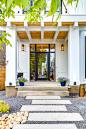 Inspiration for a large cottage entryway remodel in Calgary with a glass front door