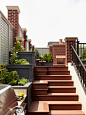 Huge elegant rooftop deck photo in Chicago with a fire pit