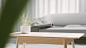 LS_white_table_with_tiny_plant_on_table_with_big_empty_space_in_94de02dd-de5b-4e3e-982d-b578f21576a5